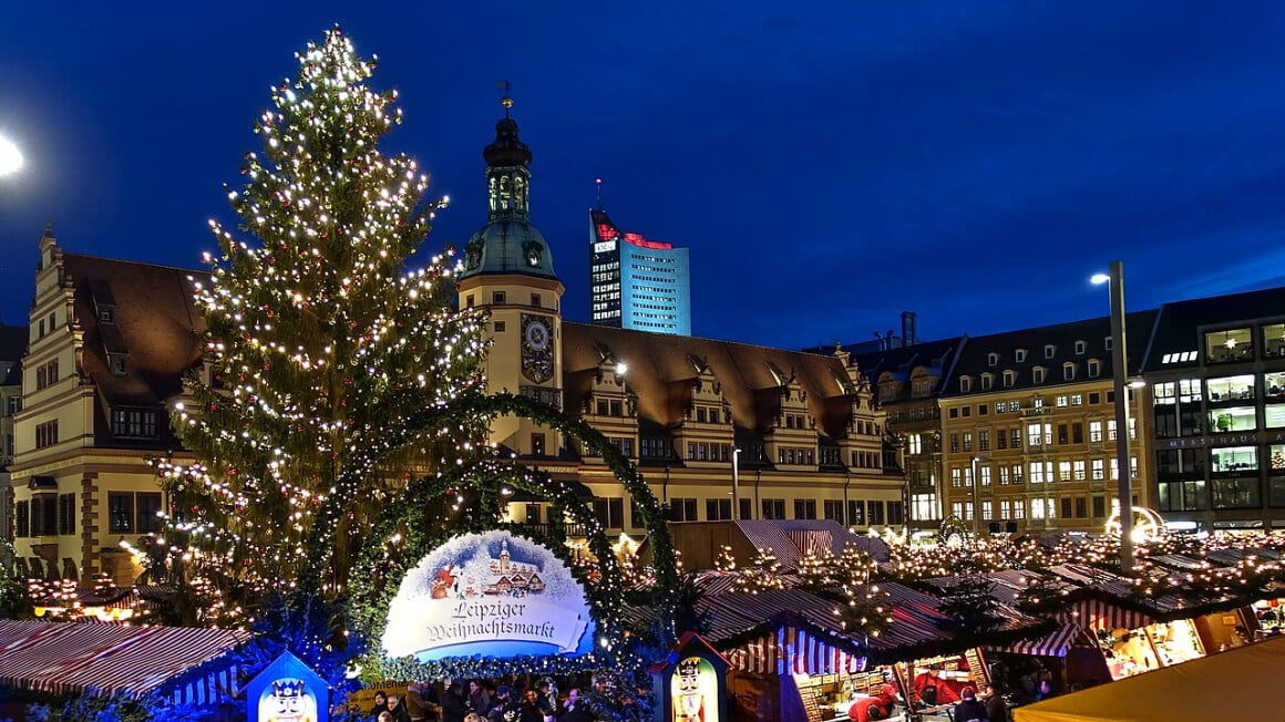 leipzig christmas market with a huge christmas tree in the middle of the stalls