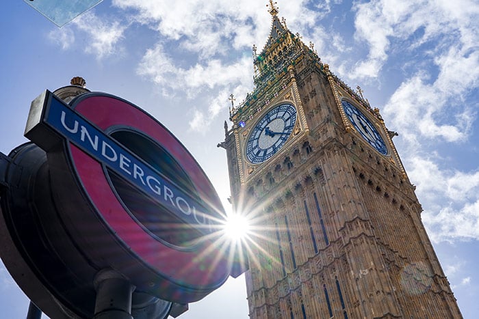 underground tube sign with big ben behind