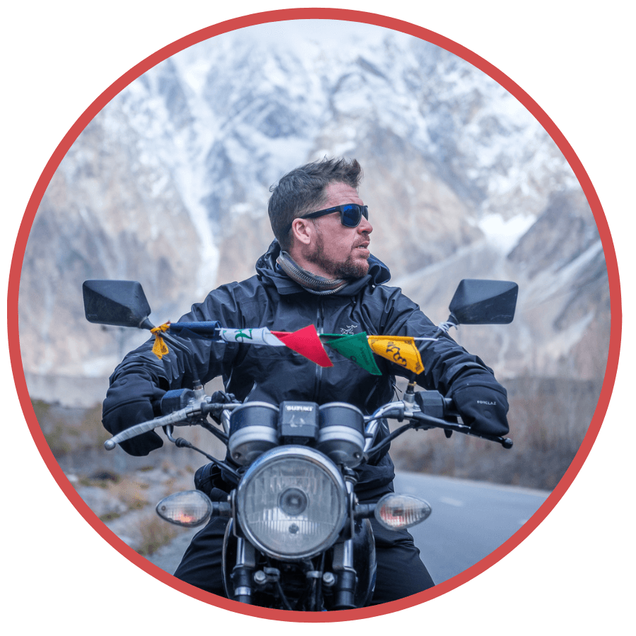 photo of Will Hatton on a motorbike, founder of The Broke Backpacker site