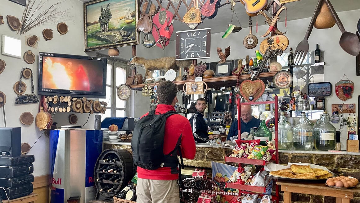 harv ordering coffee at a cafe in albania