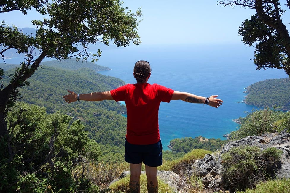 Nic standing on a cliff looking over the coastline of Turkey