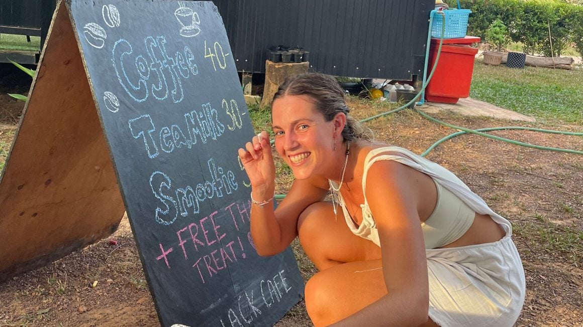 dani writing on a cafe black board