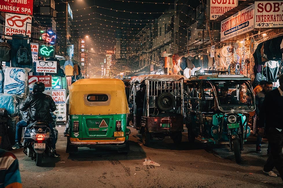 a tuk tuk/ rickshaw battling through the crazy streets of Delhi, India