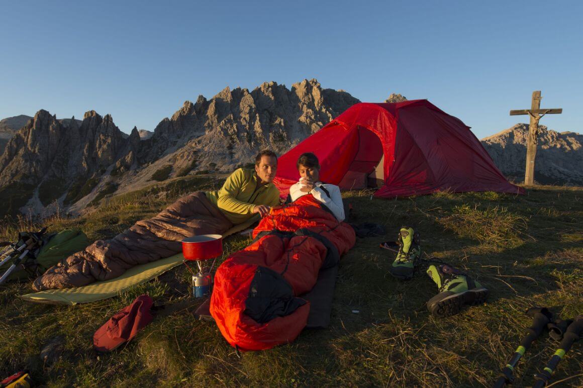 couple staying overnight in mountain base camp