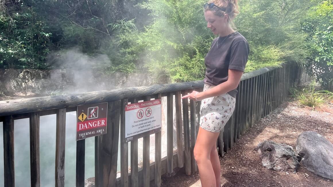 Maria at a steaming geothermal pool in Kuirau Park in Rotorua New Zealand