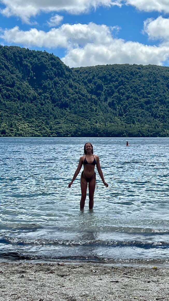 Maria having a swim in Lake Tikitapu Rotoroua Blue Lake, New Zealand