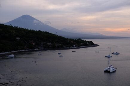 sitting in tropikal cafe in amed jemeluk bay