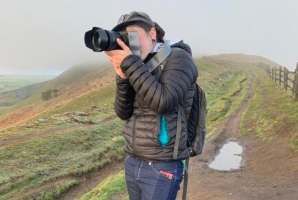 Nic taking a photo on Mam Tor mountain in the peak district, England, United Kingdom