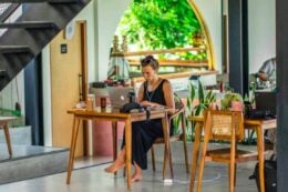 digital nomad woman working in cafe